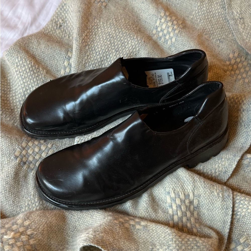 Donald J. Pliner "Uwait" black leather slip-on loafers
